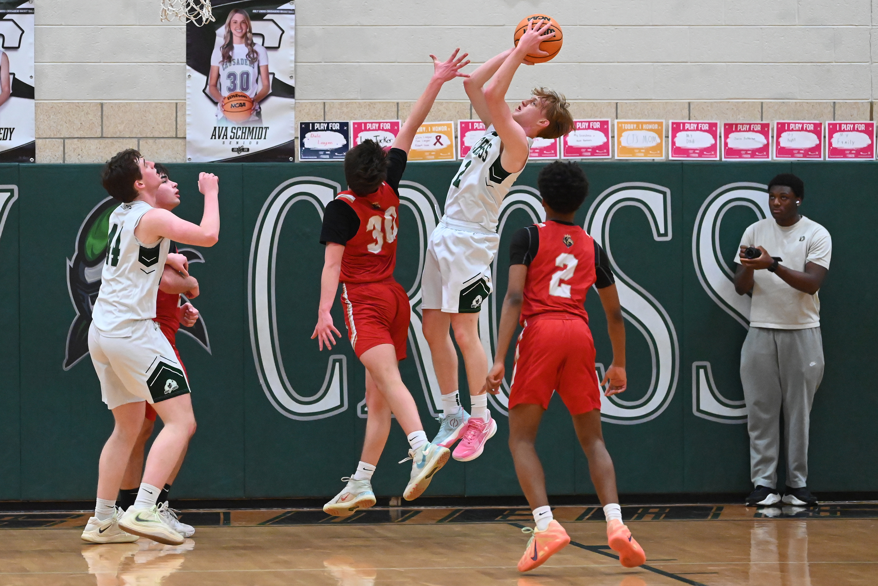 Holy Redeemer’s Charlie Schaffer defends Holy Cross’ Adam Badyrka during...
