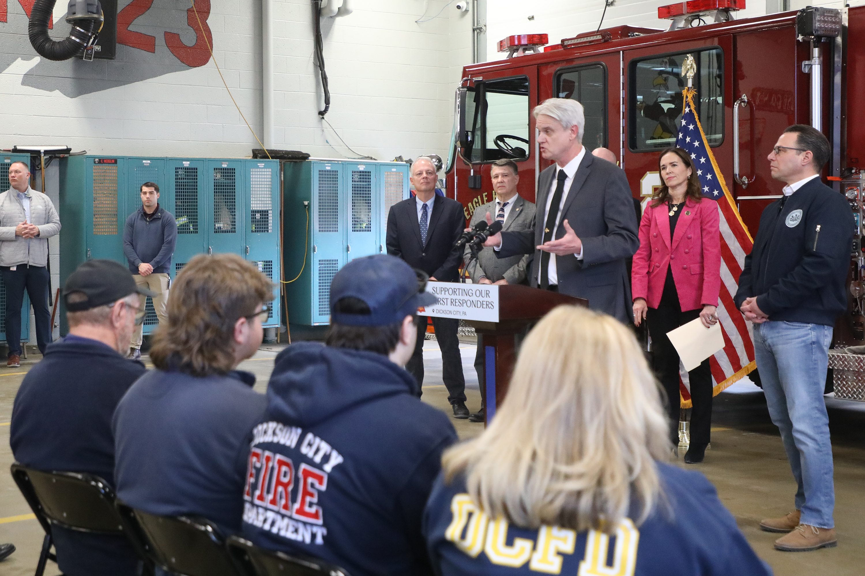Community members listen to Dickson City Mayor Robert MacCallum during...
