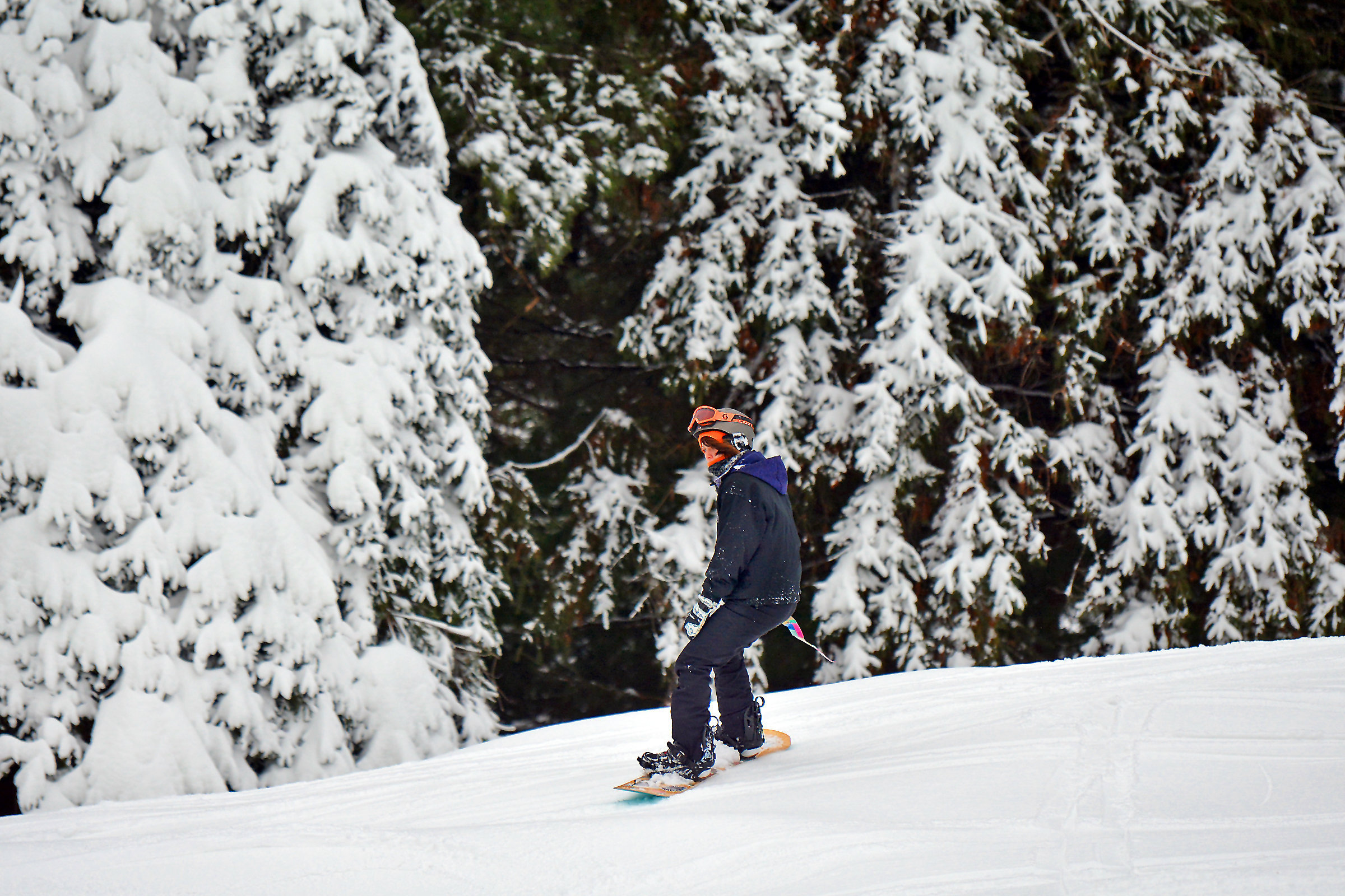 A snowboarder glides down a slope at Elk Mountain Ski...