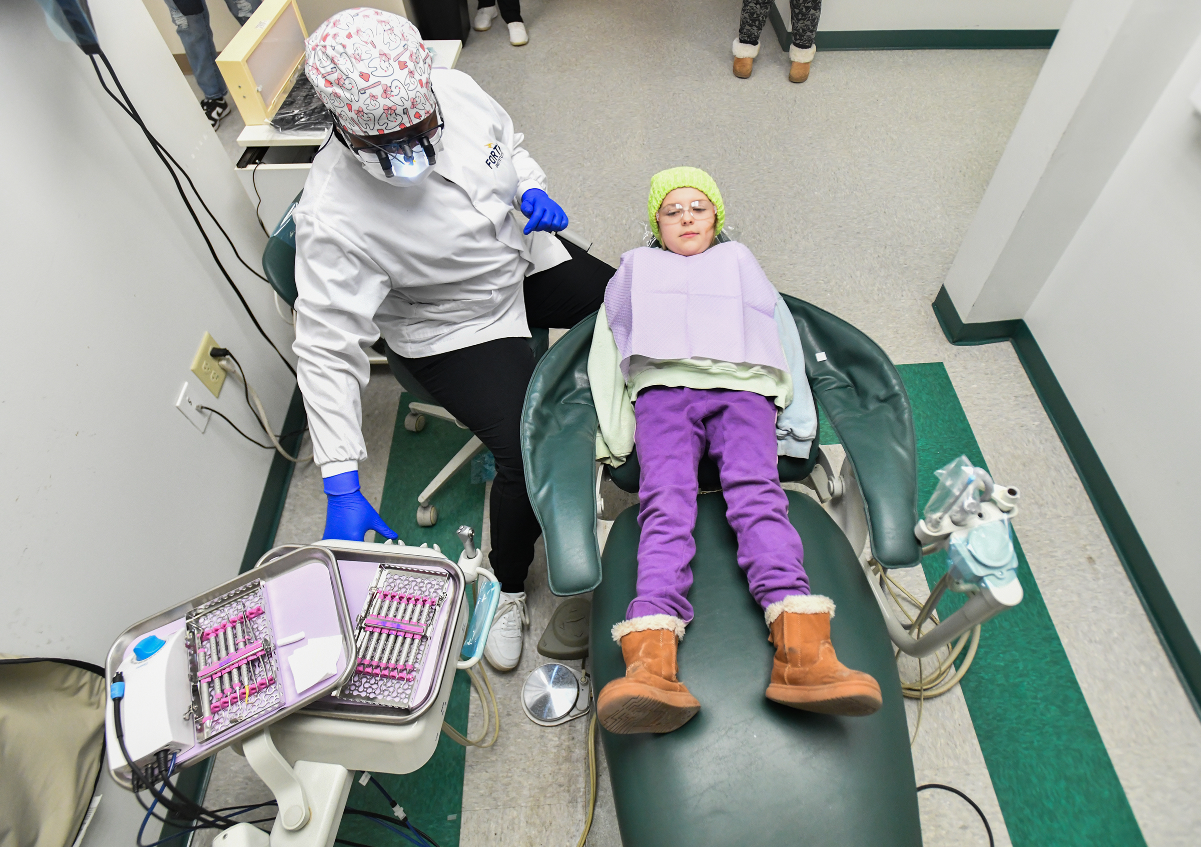 Madelyn Murphy, 8, of Clarks Summit gets a dental exam...