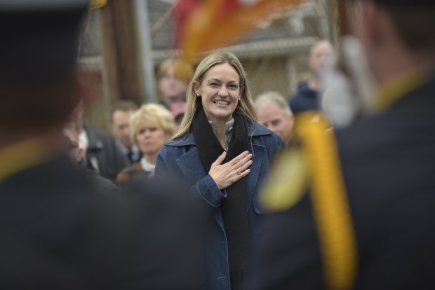 Scranton Mayor Paige Gebhardt Cognetti leads the Pledge of Allegiance at the renaming of the North Scranton Mini Park on Wayne Avenue on Friday, Nov. 21. The park was renamed to honor the late, retired Scranton firefighter Anthony "Tony" Walsh, who died in 2022. The park abuts the rear of the Scranton Fire Department's Engine 8 station. (CHAD SEBRING/STAFF PHOTO)