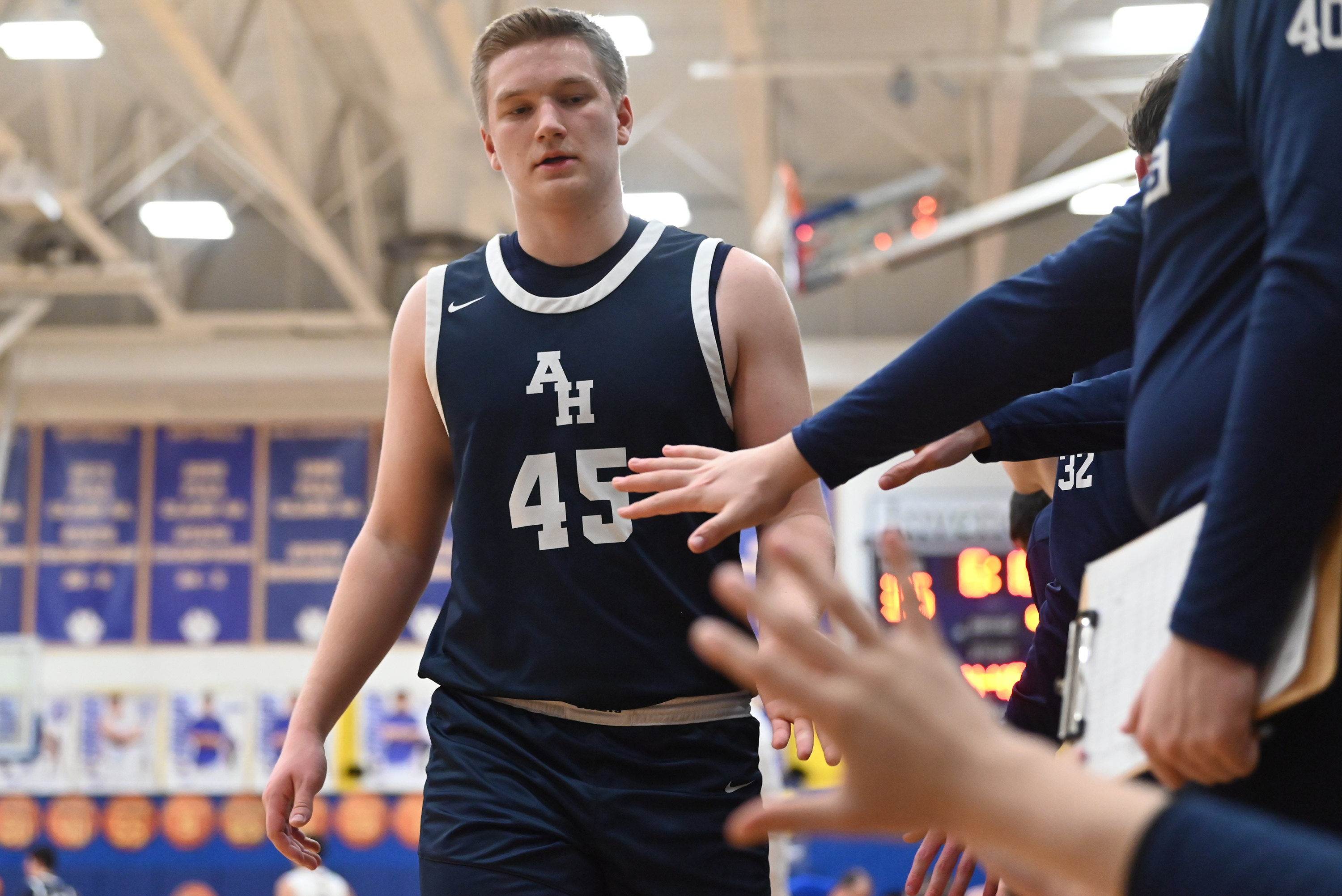 Abington Heights’ Carter Plantz high fives teammates as he returns...