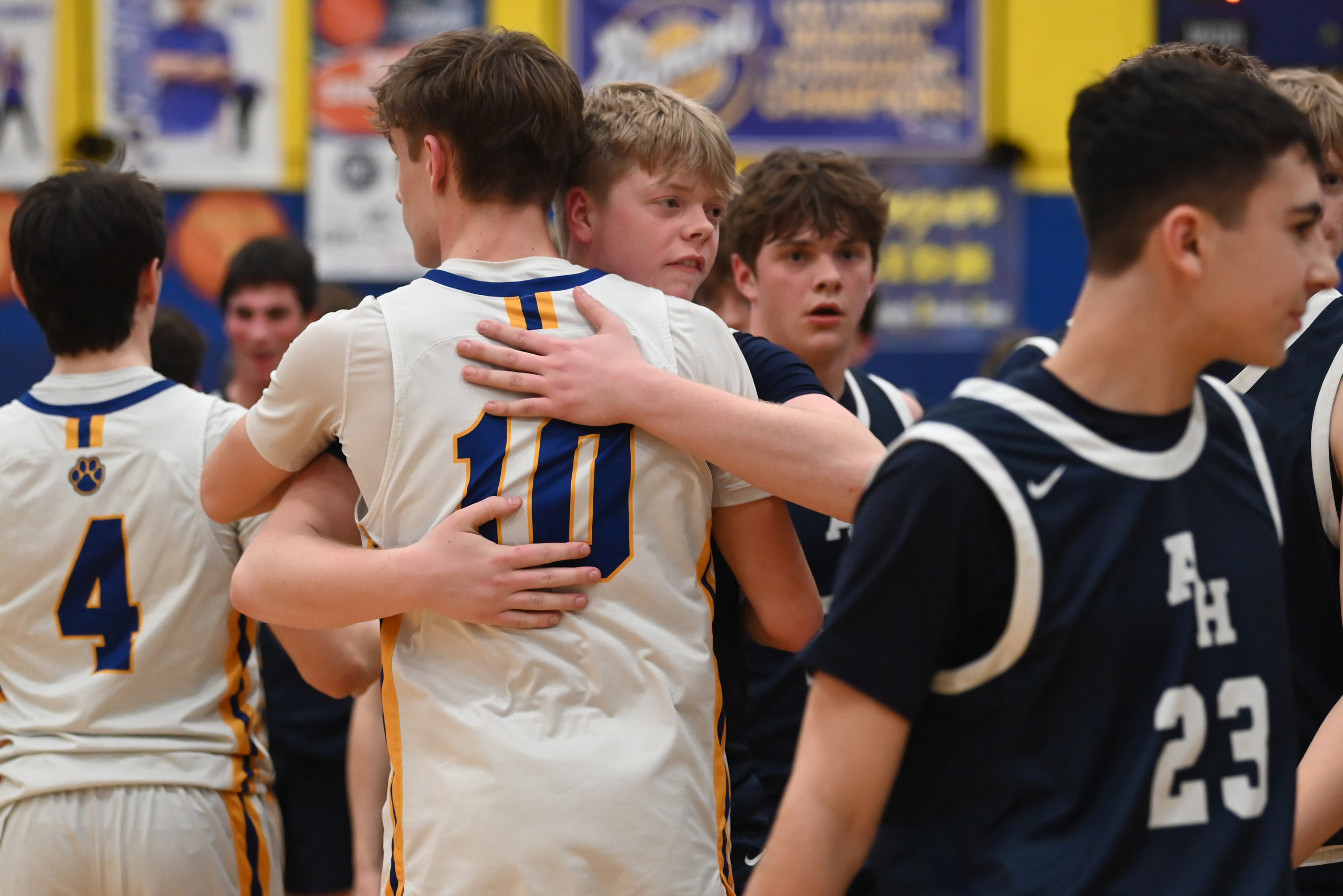 Abington Heights’ Ben Reese shares a hug with Valley View’s...