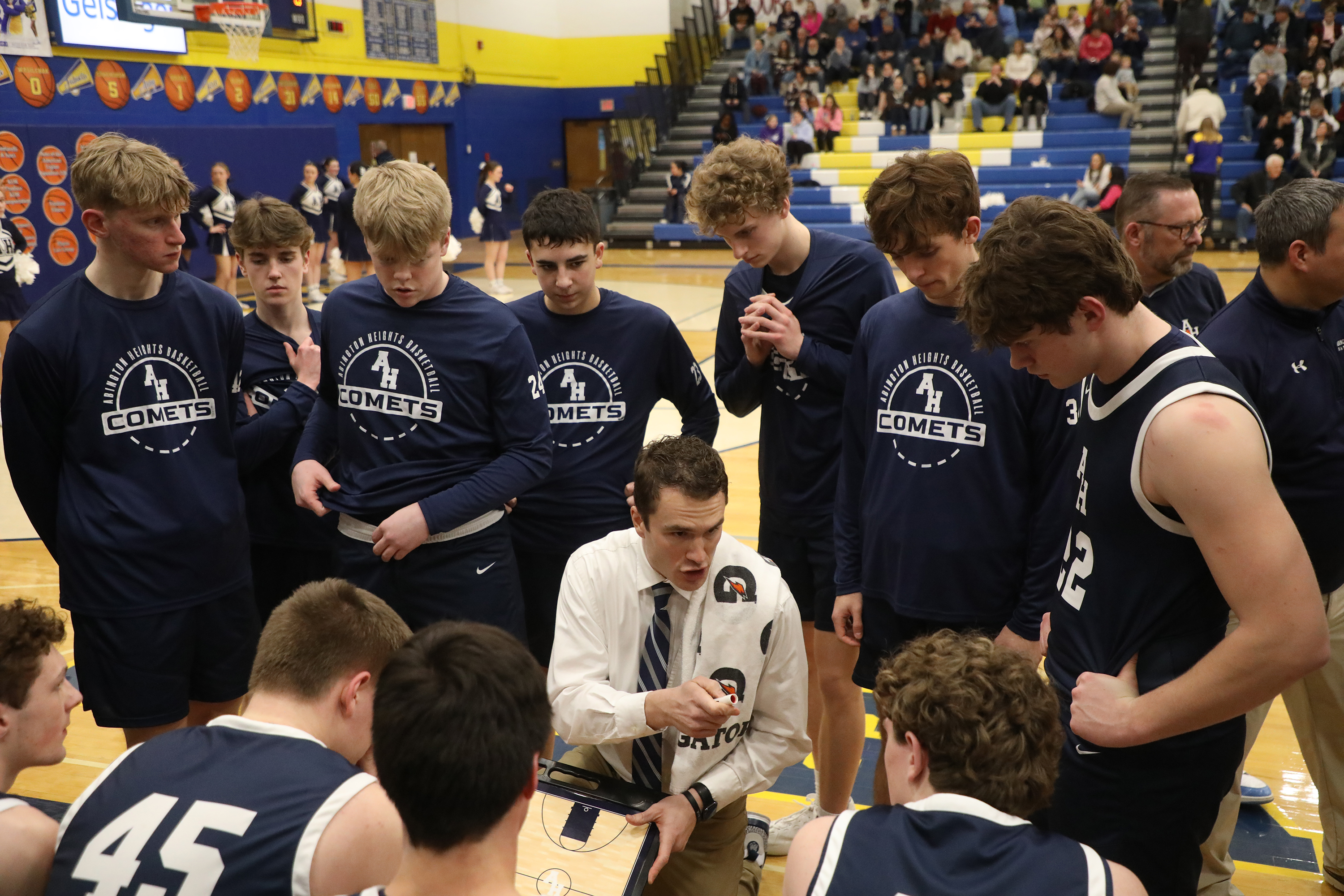 Abington Heights’ head coach J.C. Show talks to his players...