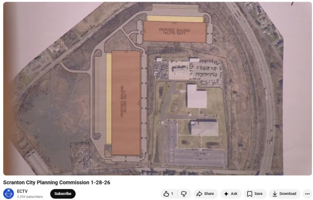A rendering of where two warehouses would go, next to and behind the Armed Forces Reserve Center in middle of aerial photo, on part of the fomer Marvine colliery site in North Scranton, bounded by Interstate 81, at right, Boulevard Avenue at left, and Olyphant Avenue, at bottom. (IMAGE COPIED FROM ELECTRIC CITY TELEVISION VIDEO)