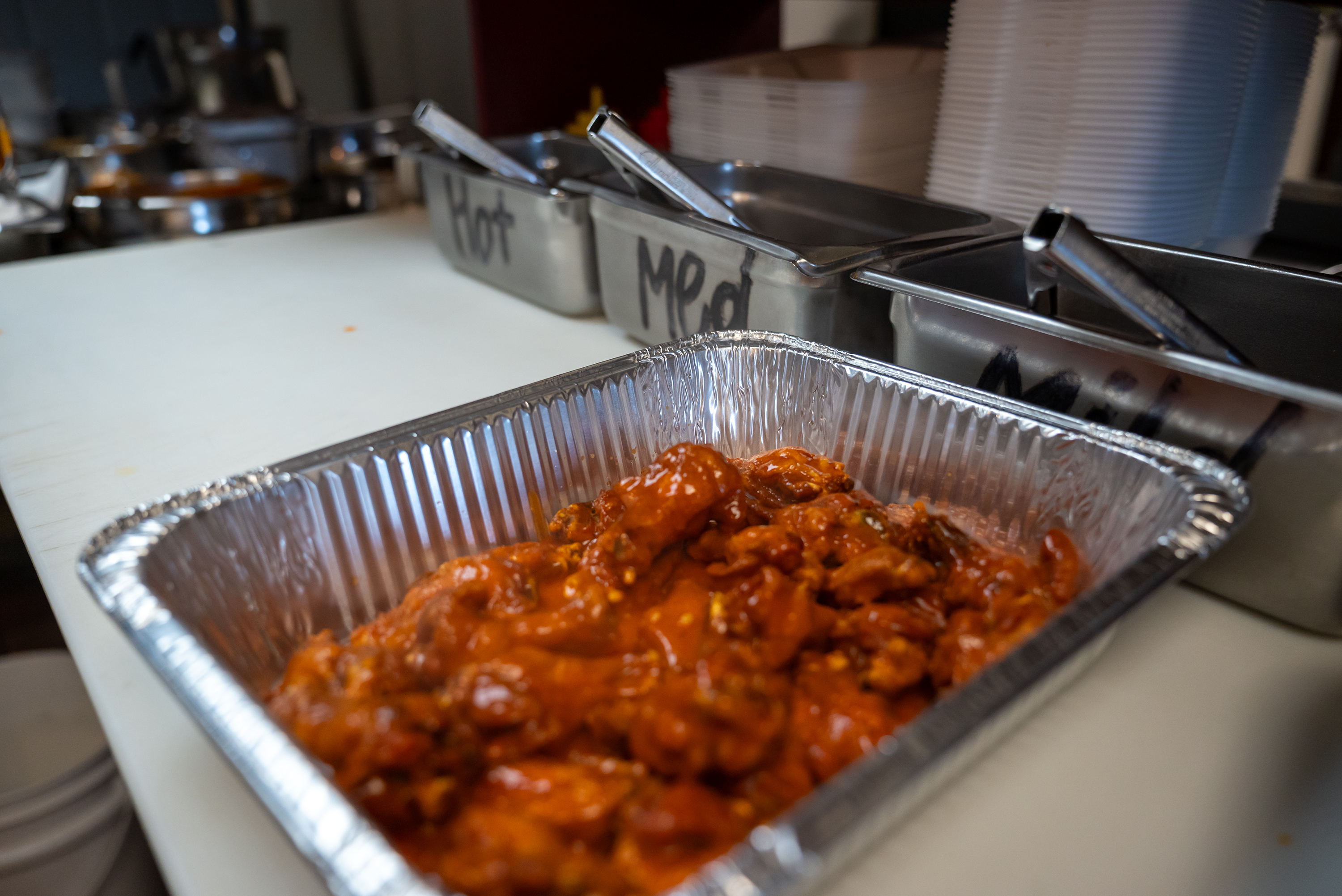 Wings in the kitchen of Kelly’s Pub and Eatery on...