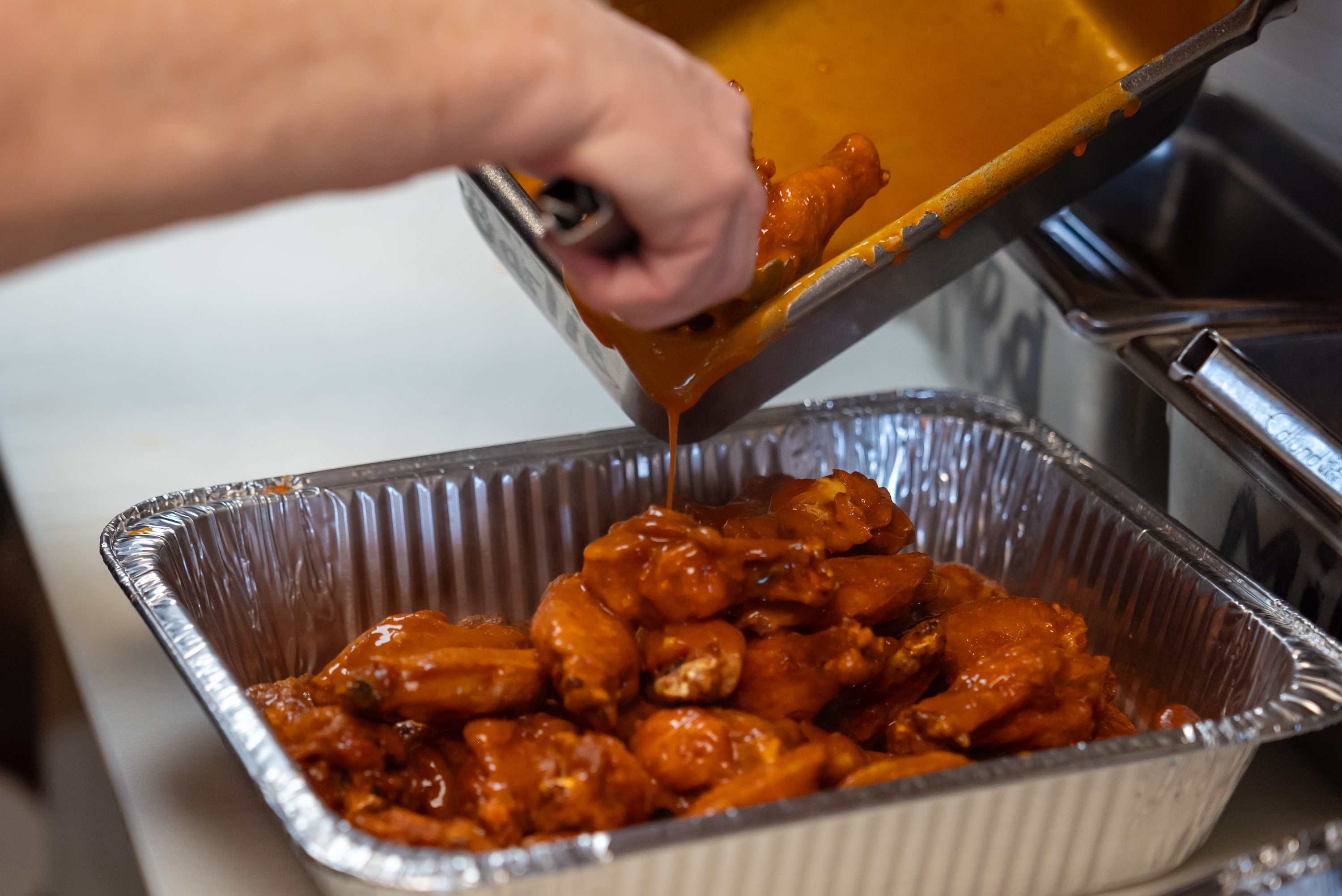 Co-owner Patricia Laboranti preps wings at Kelly’s Pub and Eatery...