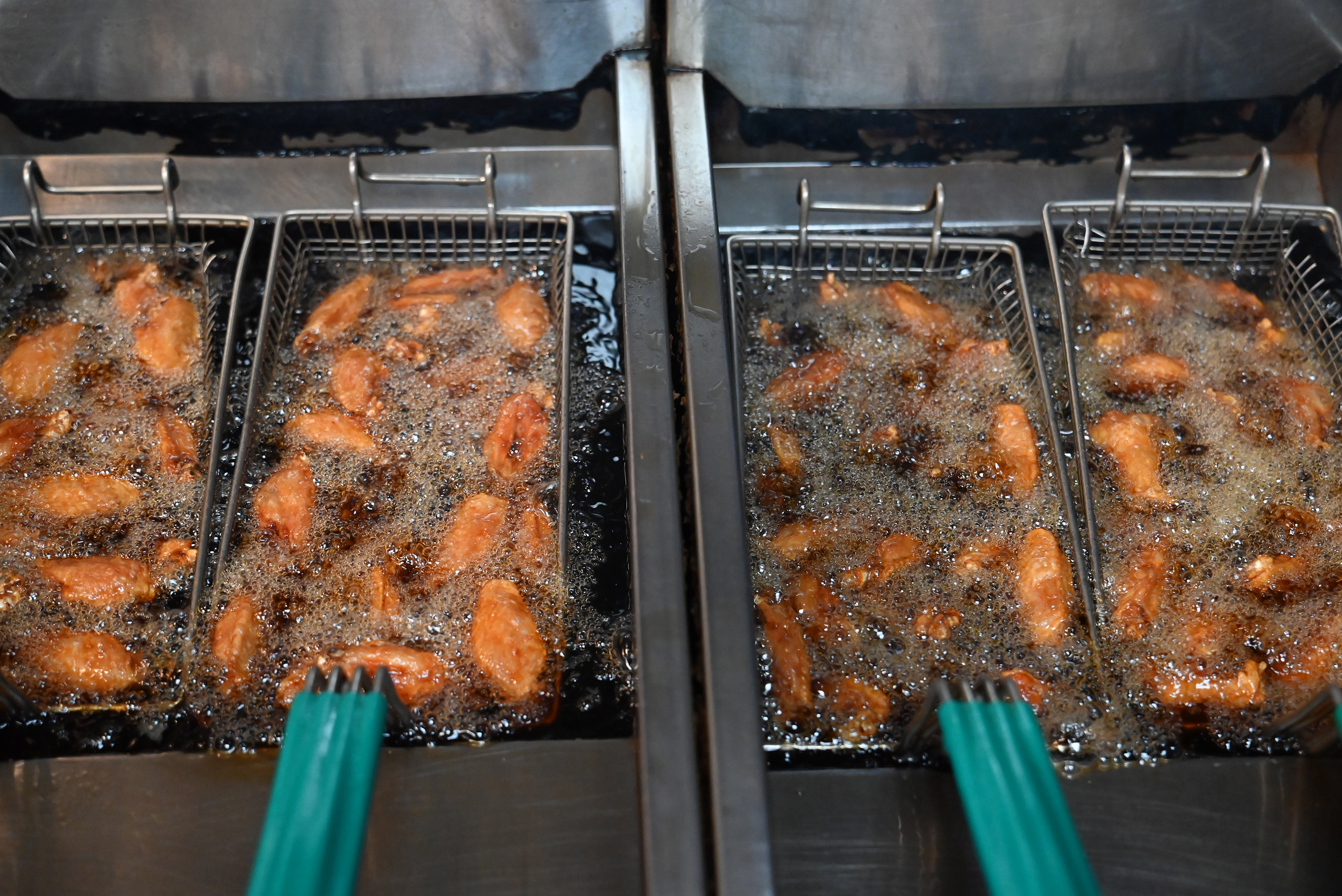 Wings in the fryer at Kelly’s Pub and Eatery on...