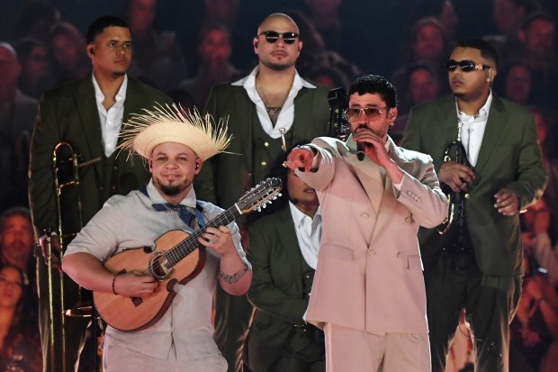 Puerto Rican rapper Bad Bunny, right, performs Jan. 23, 2026, during his "Debi tirar mas fotos" world tour at the Atanasio Girardot Stadium in Medellin, Colombia. (Jaime SALDARRIAGA / AFP via Getty Images)