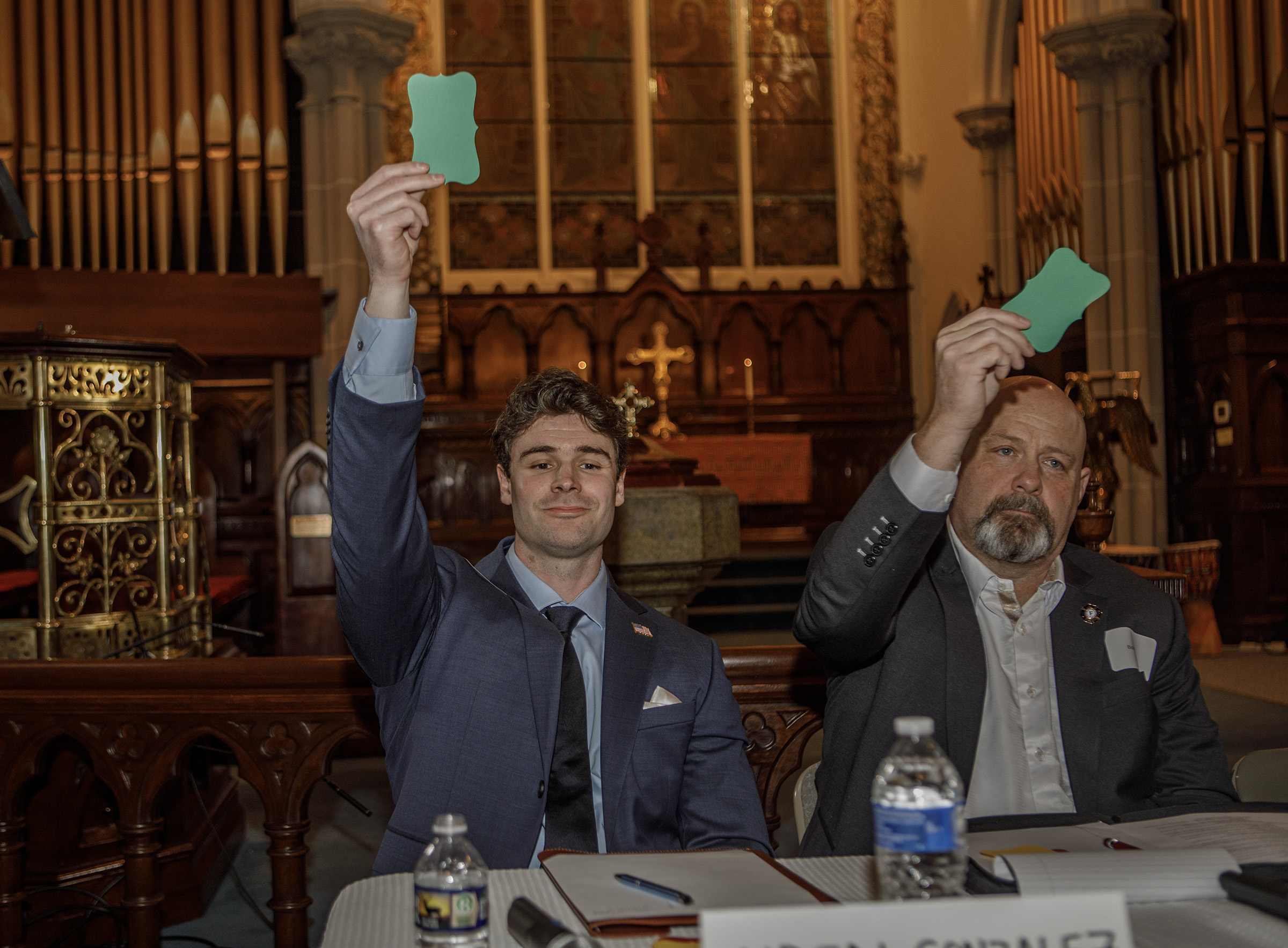 Aiden Gonzalez and Bob Banks, both Democratic candidates, hold up...