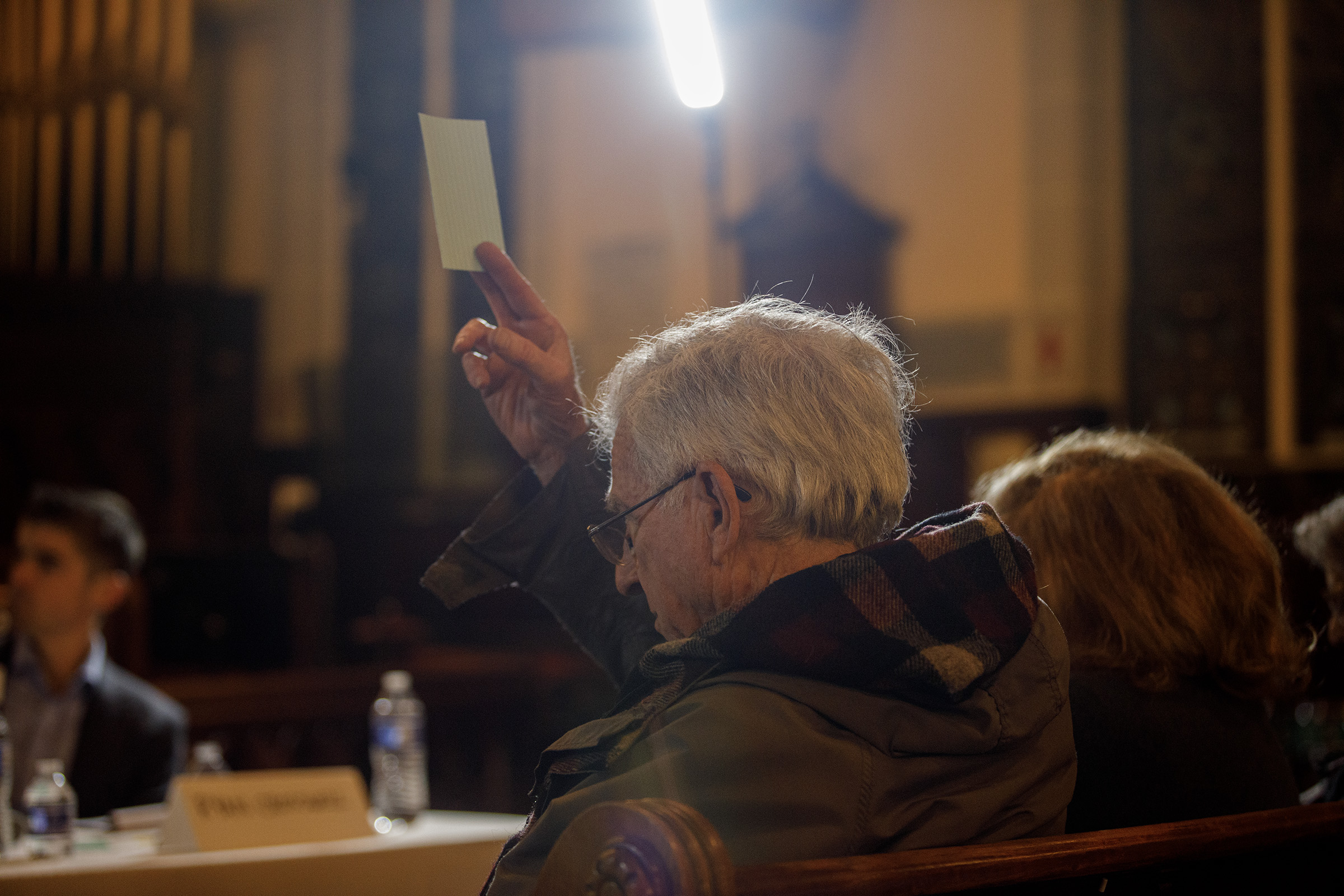 Dan Poresky of South Whitehall holds up a white card...