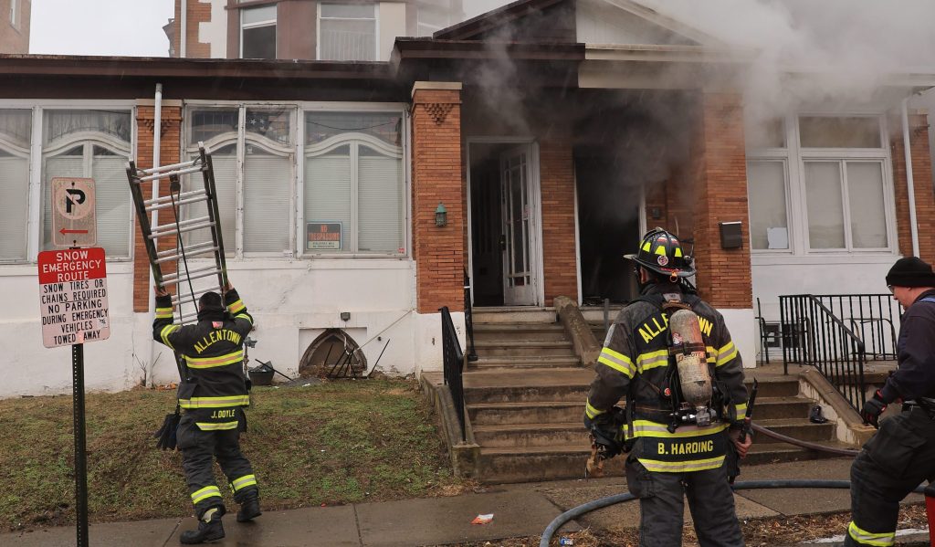 Allentown firefighters rescue two from house fire