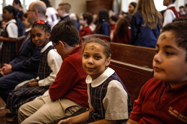 Sydney Derrick, 8, a student at St. John Vianney Regional School, shows off her ashes during Ash Wednesday Mass on Wednesday, Feb. 18, 2026, at the Cathedral of St. Catharine of Siena in Allentown. (Jane Therese/Special to The Morning Call)