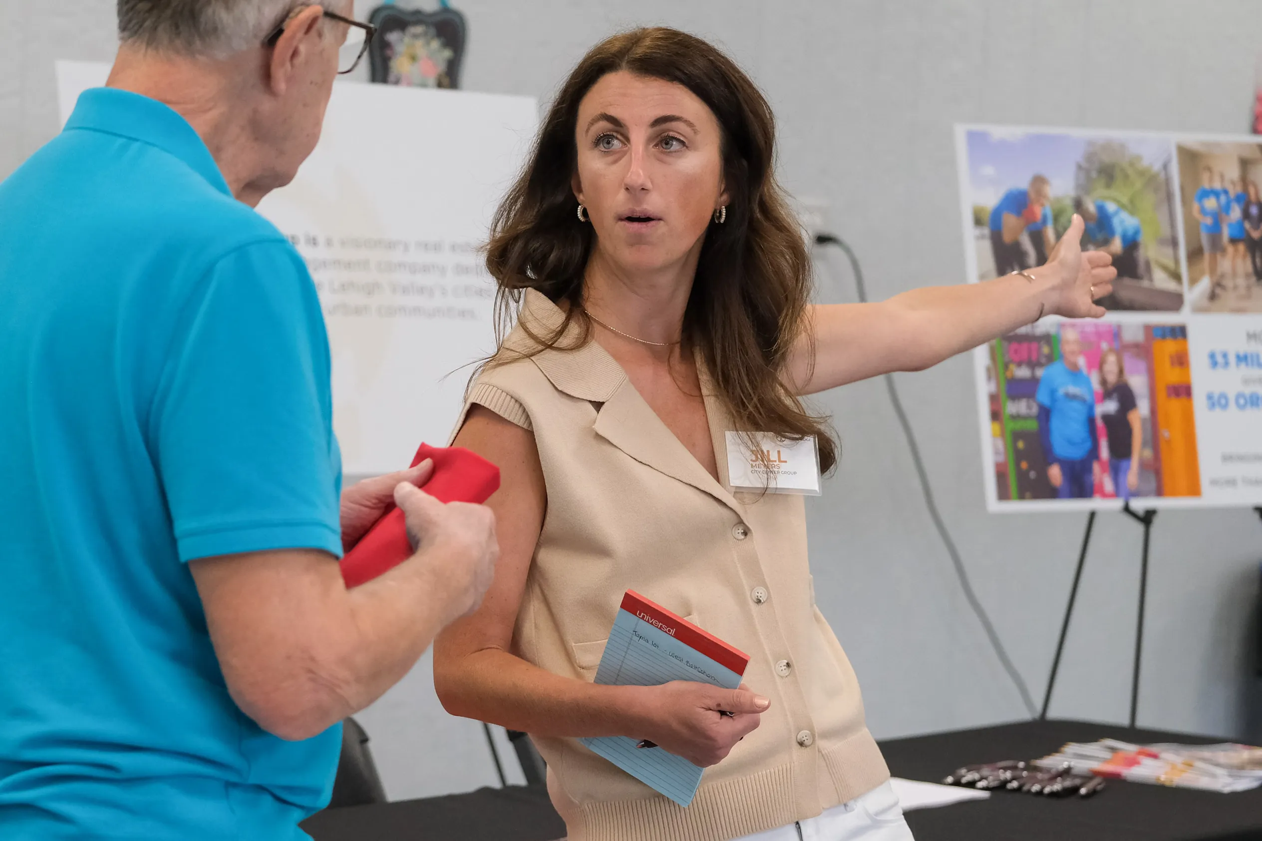 Jill Meyers of the Center City Group talks with an...