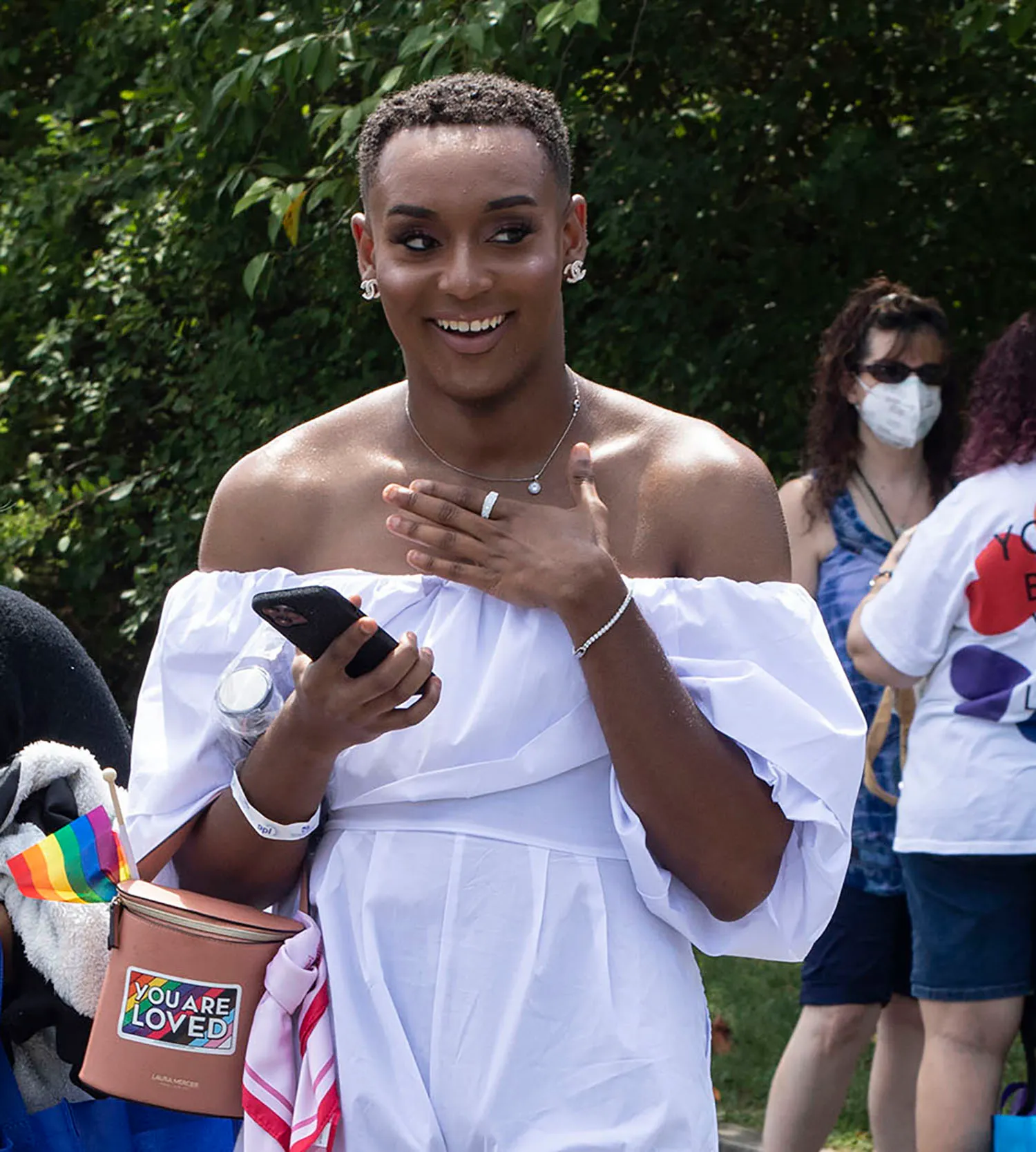 Clementine Jorge and Alex Reyes, both from Allentown walk with...
