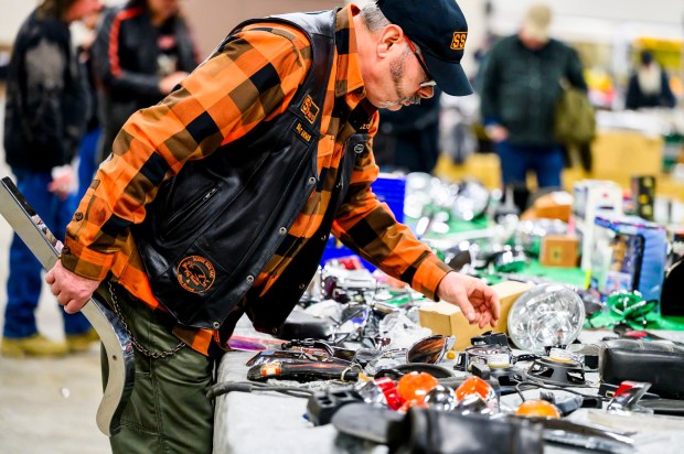 Frank Mosser III, member of SouthSide Motorcycle Club Allentown looks at various motorcycle parts for sale during the Lehigh Valley Motorcycle Expo on Friday, Feb. 6, 2026, at the Agri-Plex at the Allentown Fairgrounds in Allentown. The expo continues 9 a.m. to 7 p.m. Saturday and 9 a.m. to 3 p.m. Sunday. (April Gamiz/The Morning Call)