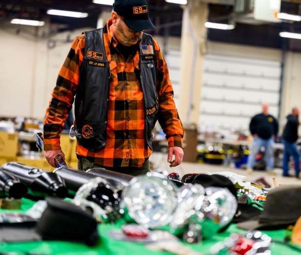 Frank Mosser III, member of SouthSide Motorcycle Club Allentown looks at various motorcycle parts for sale during the Lehigh Valley Motorcycle Expo on Friday, Feb. 6, 2026, at the Agri-Plex at the Allentown Fairgrounds in Allentown. The expo continues 9 a.m. to 7 p.m. Saturday and 9 a.m. to 3 p.m. Sunday. (April Gamiz/The Morning Call)