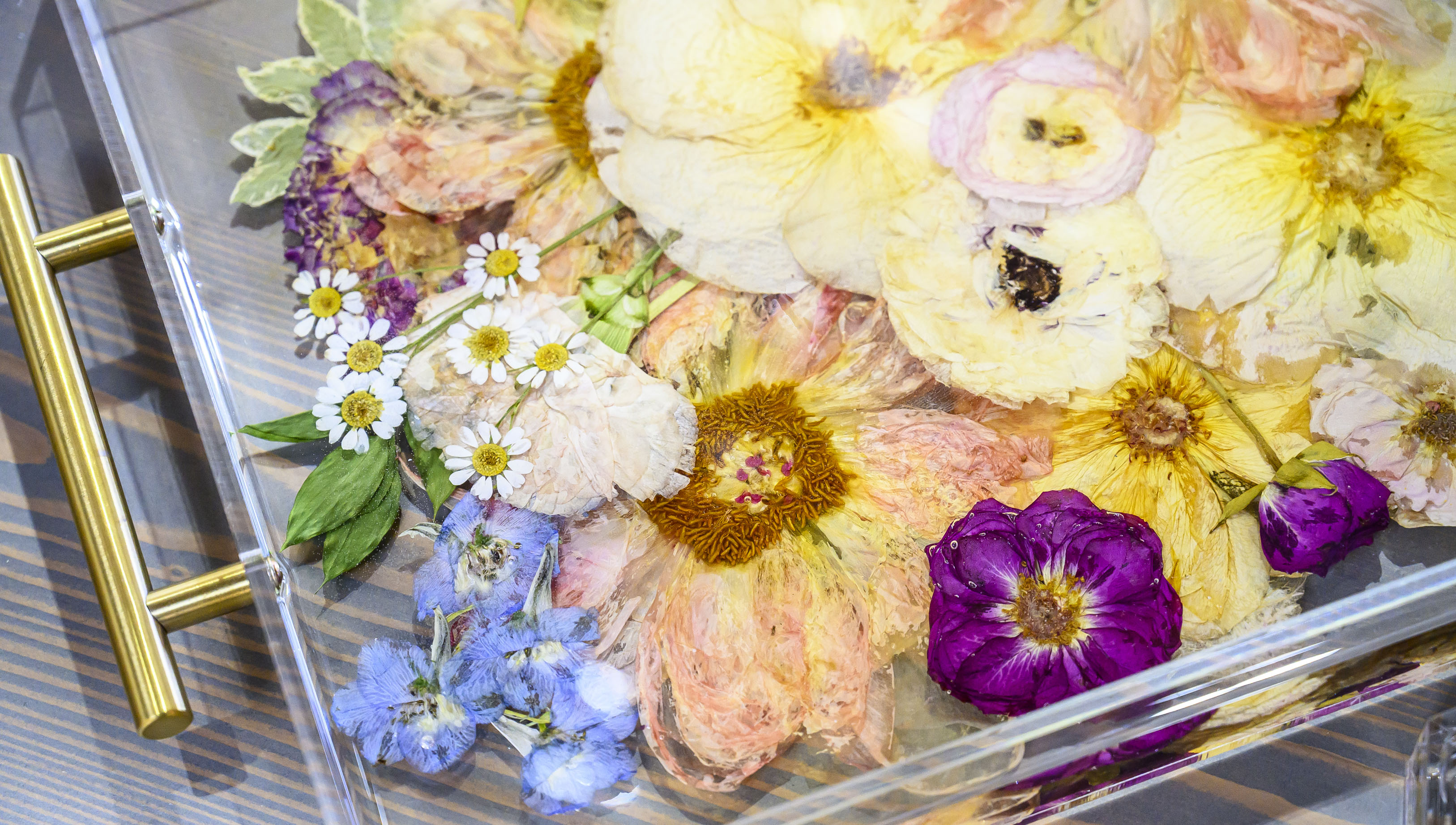 Resin art with pressed flowers is displayed Friday, Feb. 13,...