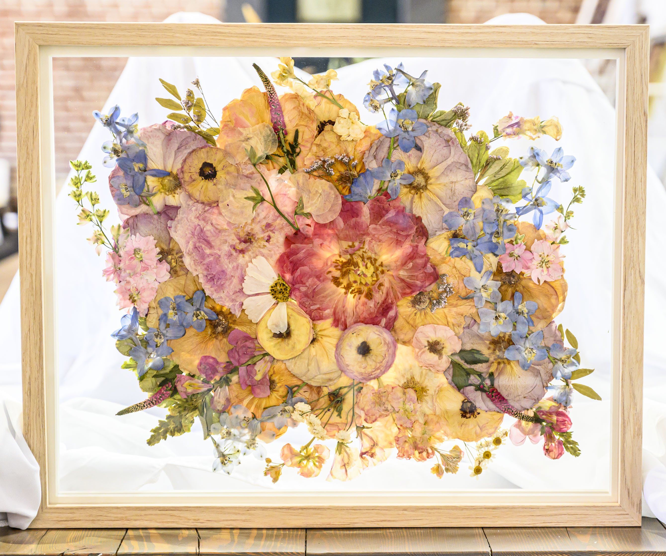 Pressed flower frames and resin art is displayed Friday, Feb....