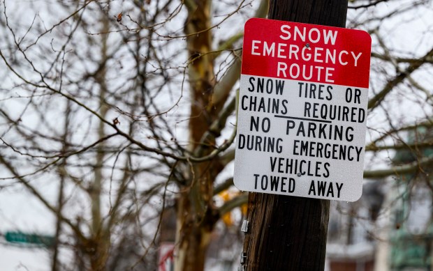 A snow emergency sign posted Sunday, Feb. 22, 2026, on Hamilton Street in Allentown. The city declared an emergency ahead of a winter storm Sunday into Monday that was expected at various points to drop anywhere from 7 to 18 inches of snow in the region. Cars can be parked in city parking garages for free until 6 p.m. Tuesday. (April Gamiz/The Morning Call)