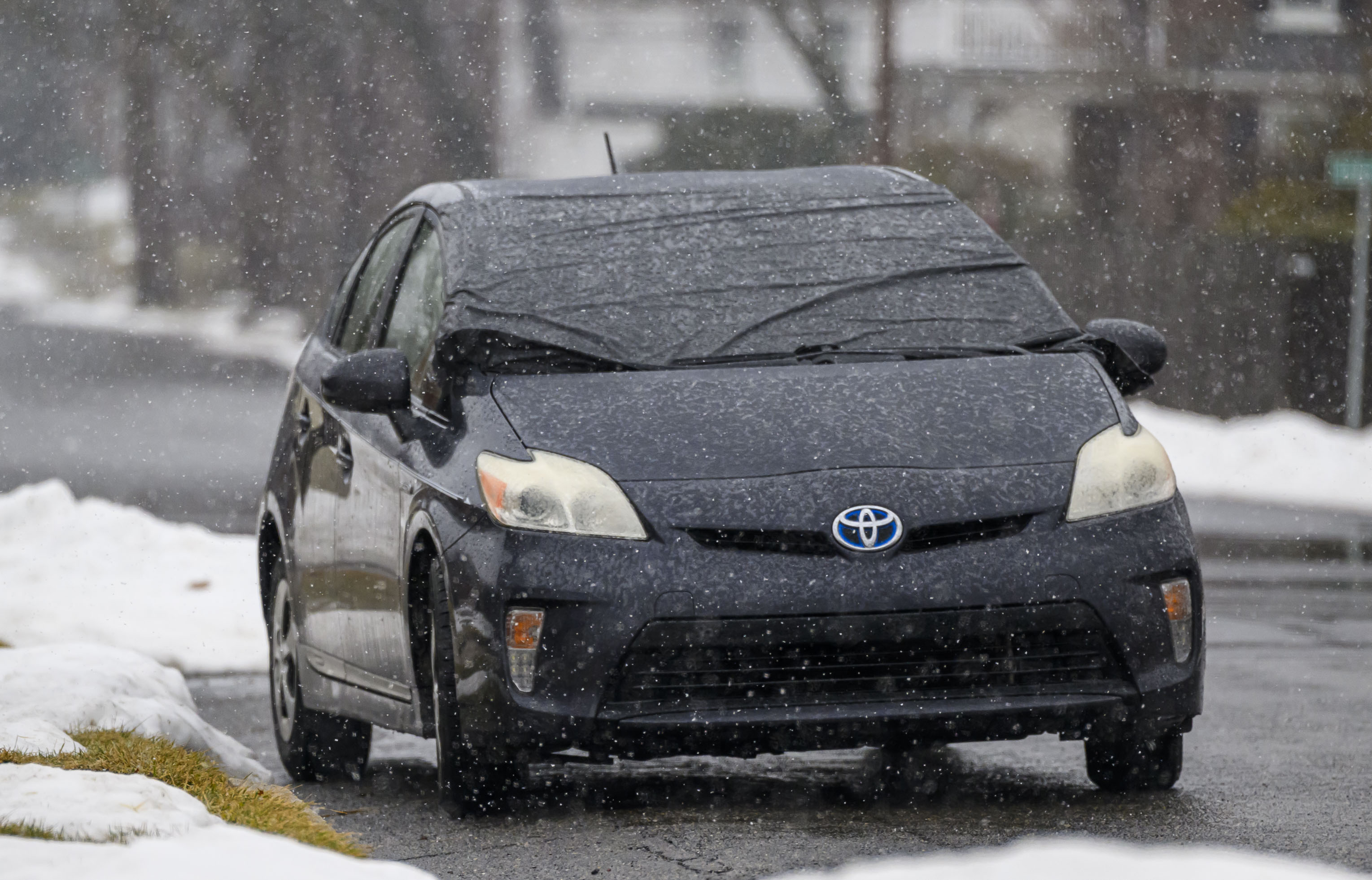 A car's windshield is covered Sunday, Feb. 22, 2026, in Bethlehem to protect it from a storm expected to drop 7-14 inches of snow in the region Sunday into Monday. (April Gamiz/The Morning Call)