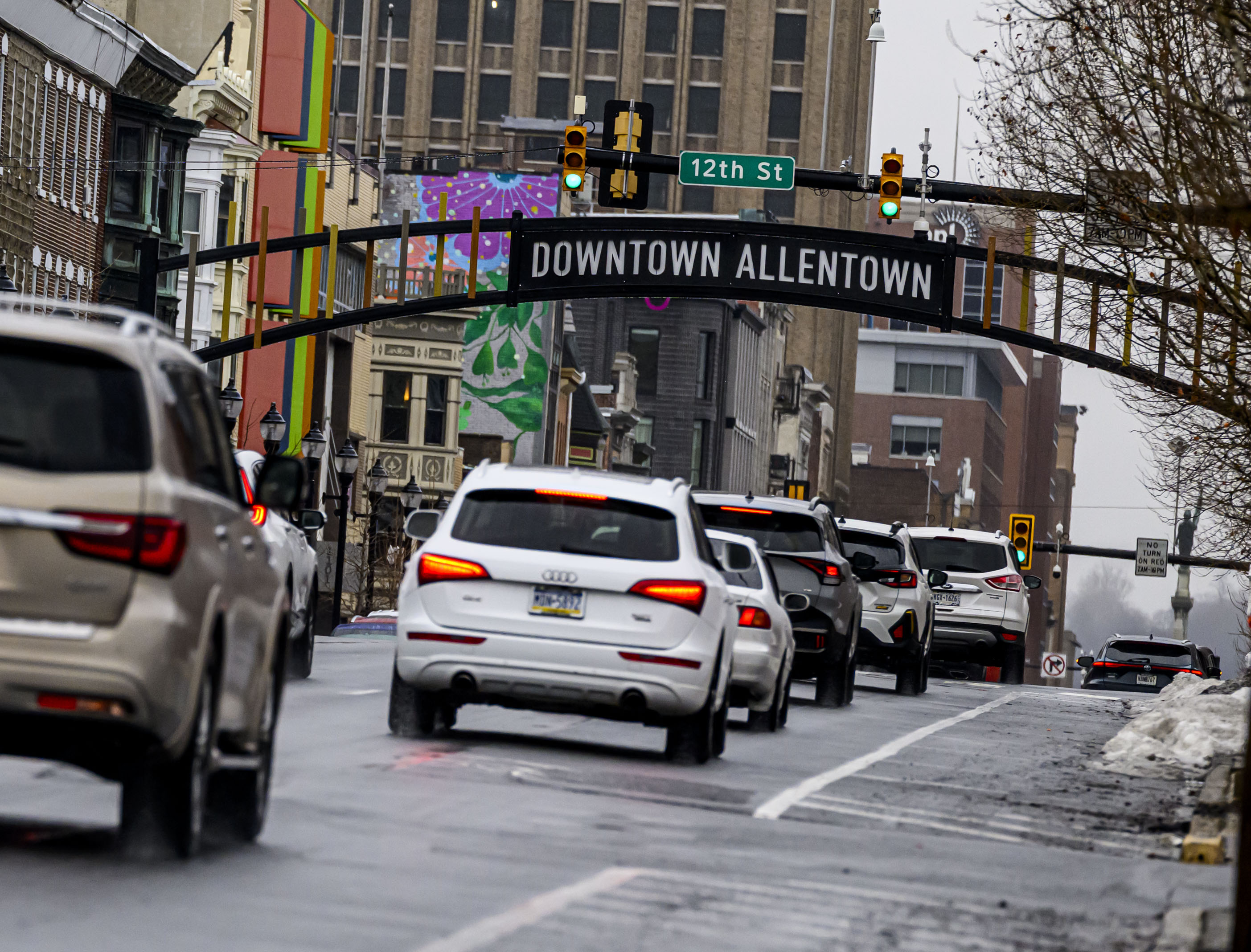 Vehicles travel in the rain Sunday, Feb. 22, 2026, on Hamilton Street in Allentown. The rain was expected to become snow later Sunday as temperatures fell, with a major storm dropping 7-14 inches of snow Sunday into Monday. (April Gamiz/The Morning Call)
