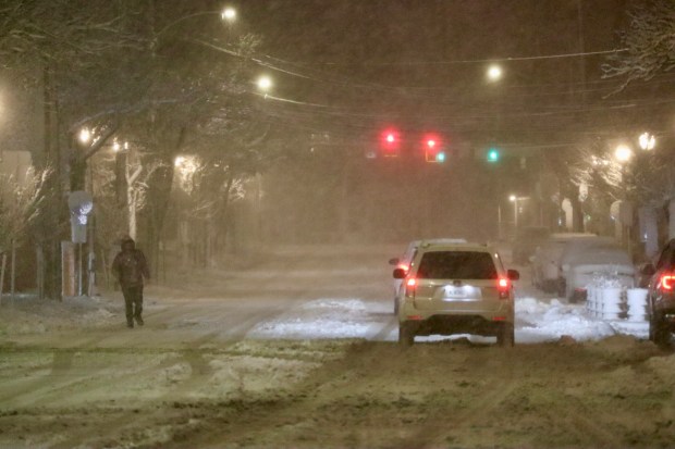 Snow falls Sunday, Feb. 22, 2026, late in the evening in Bethlehem. A winter storm was expected to drop 7-14 inches of snow in the region Sunday into Monday, though the National Weather Service said there was uncertainty about the total. (Rich Rolen/Special to The Morning Call)