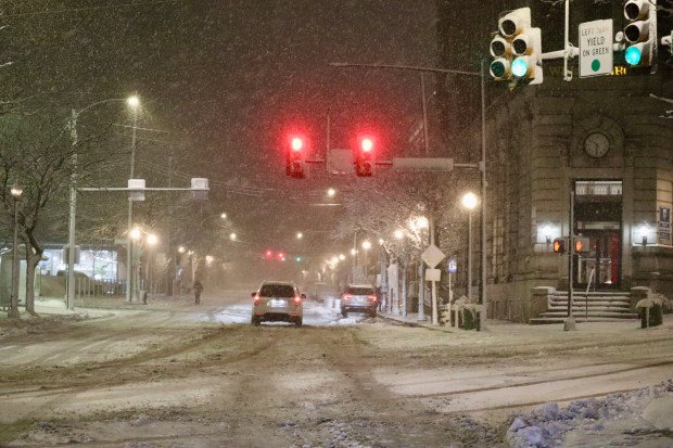 Snow falls Sunday, Feb. 22, 2026, late in the evening in Bethlehem. A winter storm was expected to drop 7-14 inches of snow in the region Sunday into Monday, though the National Weather Service said there was uncertainty about the total. (Rich Rolen/Special to The Morning Call)