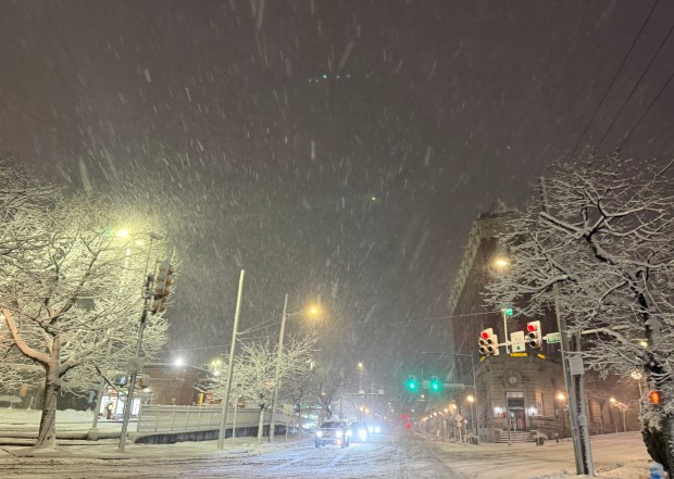 Snow falls Sunday, Feb. 22, 2026, late in the evening in Bethlehem. A winter storm was expected to drop 7-14 inches of snow in the region Sunday into Monday, though the National Weather Service said there was uncertainty about the total. (Rich Rolen/Special to The Morning Call)
