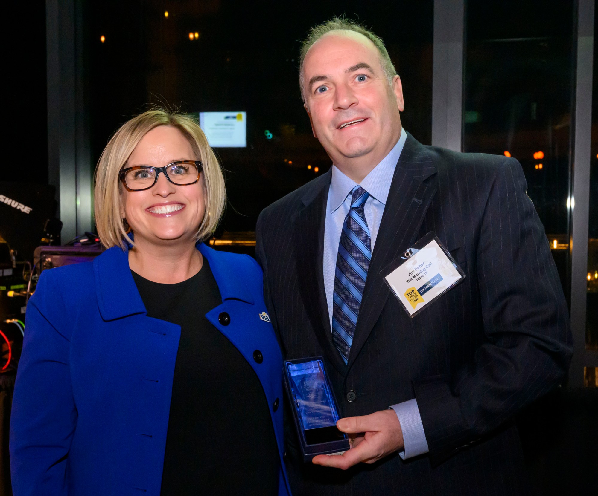 Via Of The Lehigh Valley wins Leadership award, for the category of midsize company accepted by Lisa Walkiewicz presented by The Morning Call's Jim Feher, Vice President of Advertising during The Morning Call's Lehigh Valley Top Workplaces Awards 2026 awards banquet Thursday, Feb. 26, 2026, at the ArtsQuest Center at SteelStacks in Bethlehem.(April Gamiz/The Morning Call)