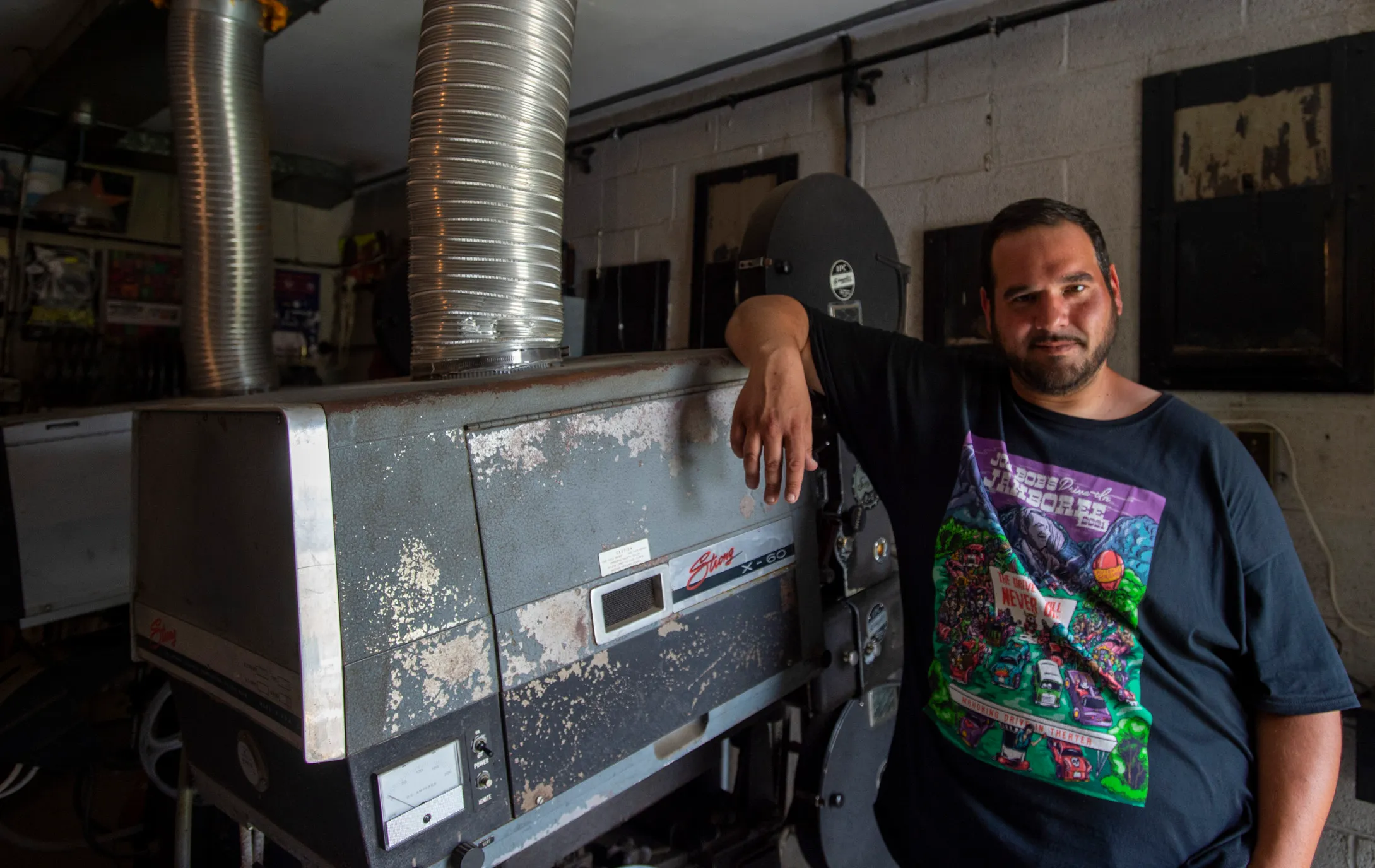 The Mahoning Drive-In’s property and theater partner Virgil Cardamore stands...