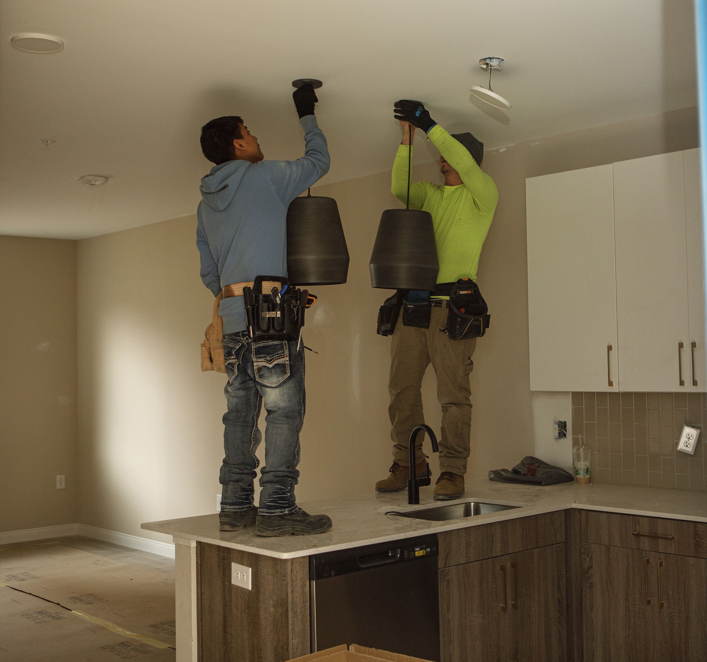Construction workers inside an apartment at the Confluence, City Center’s...