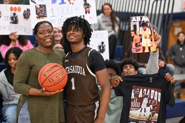 Catasauqua's Frankie Pujols and his mother Olivia celebrate his one thousandth point against Pleasant Valley during an Eastern Pennsylvania Conference boys basketball game on Monday, Dec. 29, 2025, at Northern Lehigh High School in Slatington. (Jonathan Broady/Special to The Morning Call)