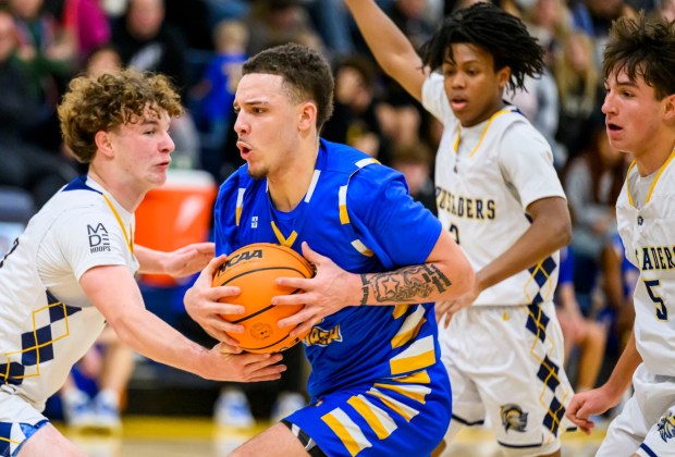 Wilson's Lafayette Acree looks to score against Notre Dame-Green Pond's Tommy Murphy on Saturday, Jan. 10, 2026, during a basketball game at Notre Dame-Green Pond High School. (April Gamiz/The Morning Call)