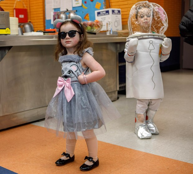 Marlee Meyerson, 3, of Allentown as on of the "three blind mice" and Nia Anderson, 5, of Macungie as Sandy from Sponge Bob during a Purim celebration Wednesday, Feb. 25, 2026, at the Jewish Day School of the Lehigh Valley in Allentown. Purim celebrates the biblical story of Esther's deliverance of the Jews in Persia from a massacre plotted by Haman. The holiday, which is marked by the retelling of the Book of Esther, gift giving, meals and costumes, begins this year on Monday evening and continues into Tuesday, March 3, 2026. (Jane Therese/Special to The Morning Call)
