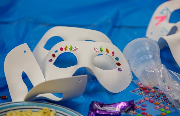Decorated masks lie on a table during a Purim celebration Wednesday, Feb. 25, 2026, at the Jewish Day School of the Lehigh Valley in Allentown. Purim celebrates the biblical story of Esther's deliverance of the Jews in Persia from a massacre plotted by Haman. The holiday, which is marked by the retelling of the Book of Esther, gift giving, meals and costumes, begins this year on Monday evening and continues into Tuesday, March 3, 2026. (Jane Therese/Special to The Morning Call)
