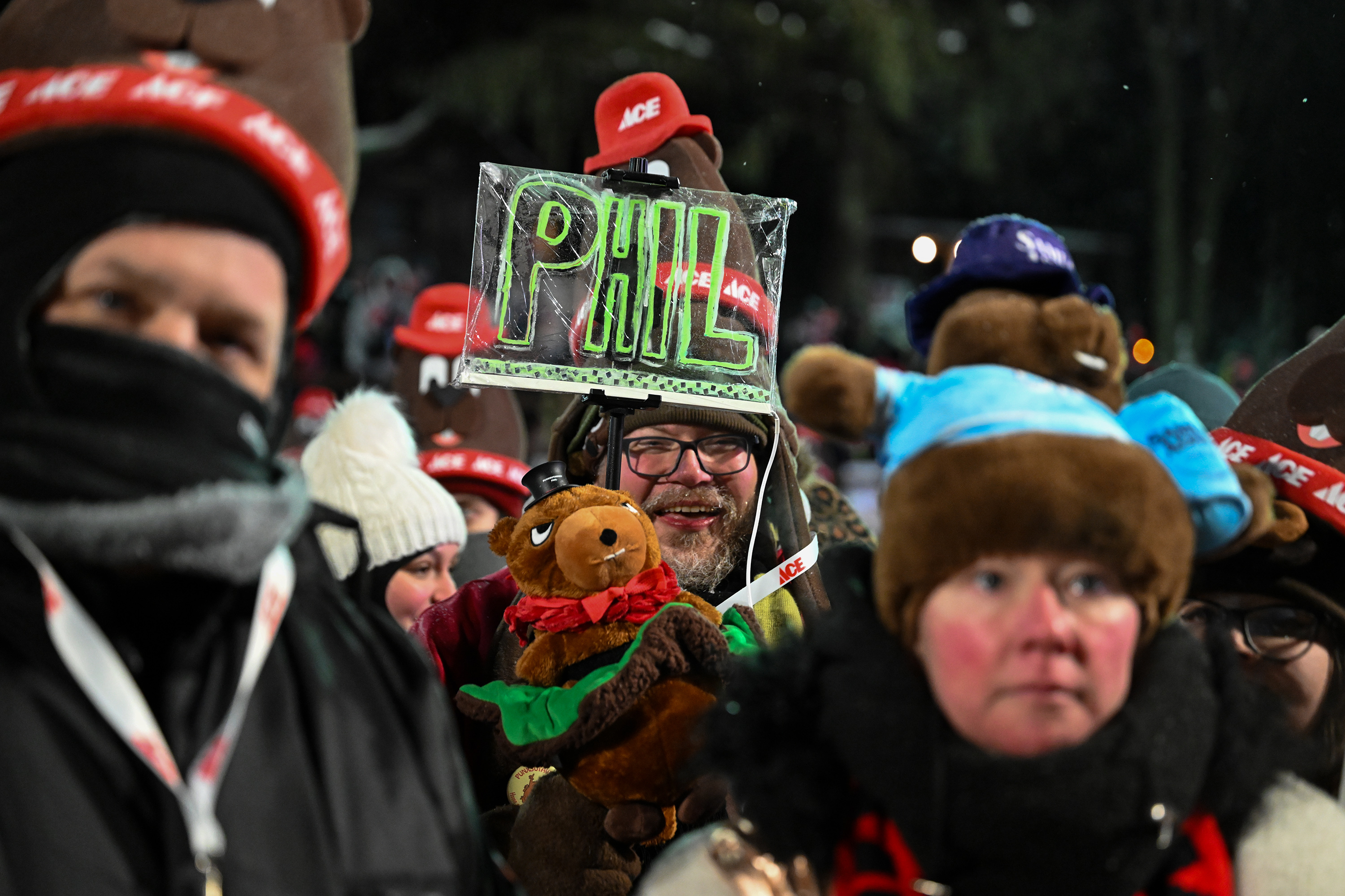 John Carpenter, of Buffalo, N.Y., celebrates while waiting for Punxsutawney...