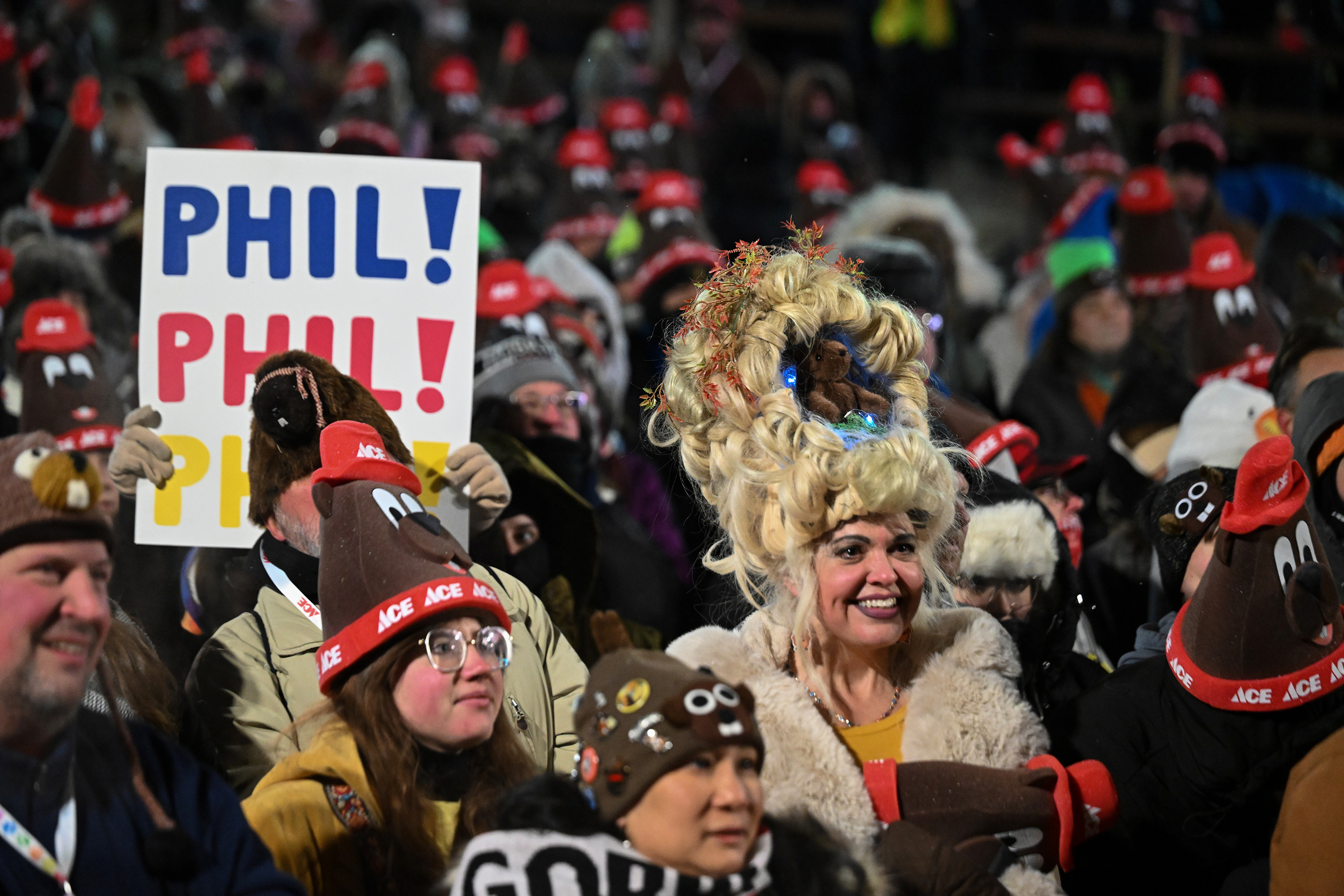 Toni Massey, of Bismack, N.D., right, celebrates while waiting for...