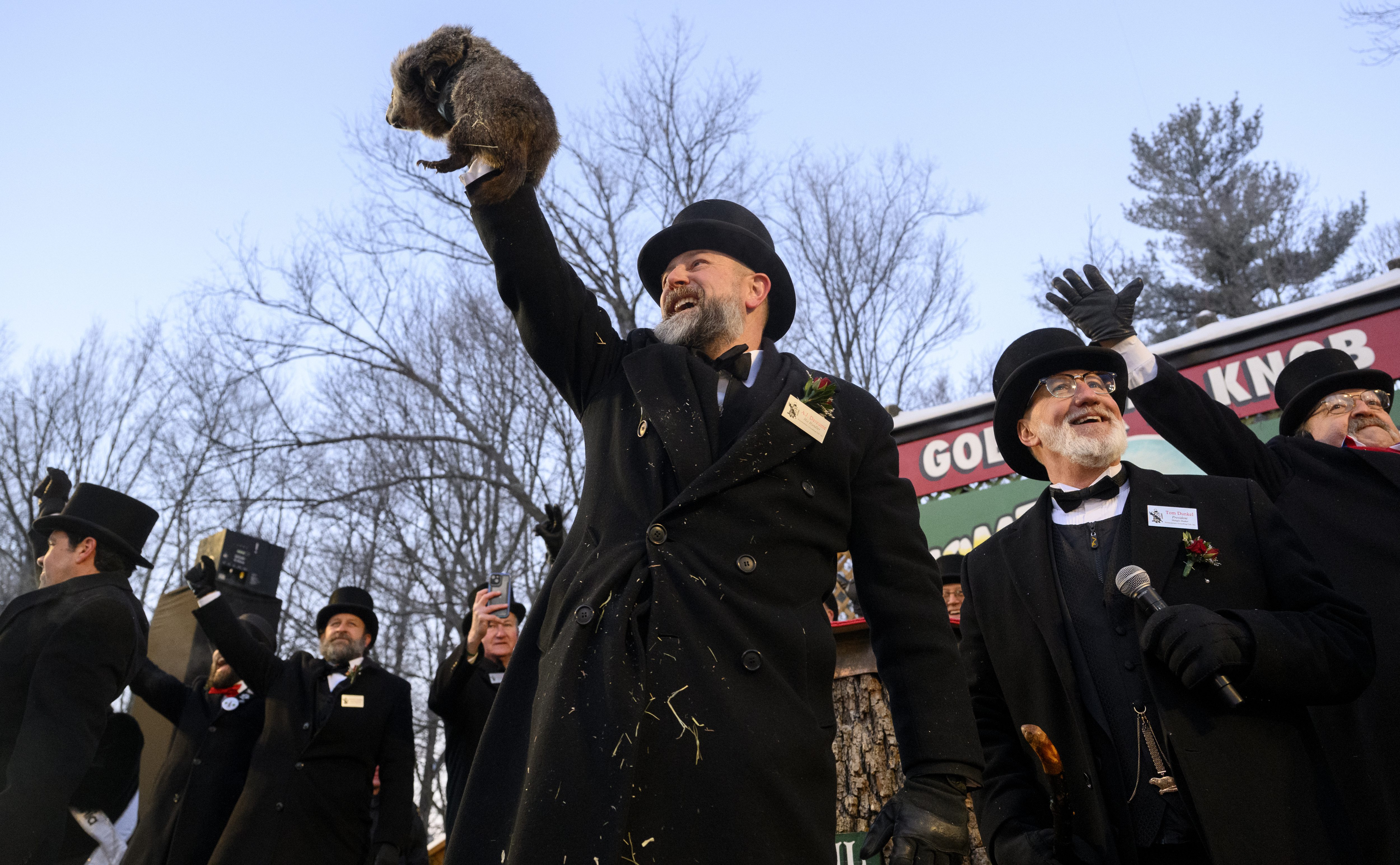 Groundhog handler AJ Dereume holds Punxsutawney Phil after he saw...