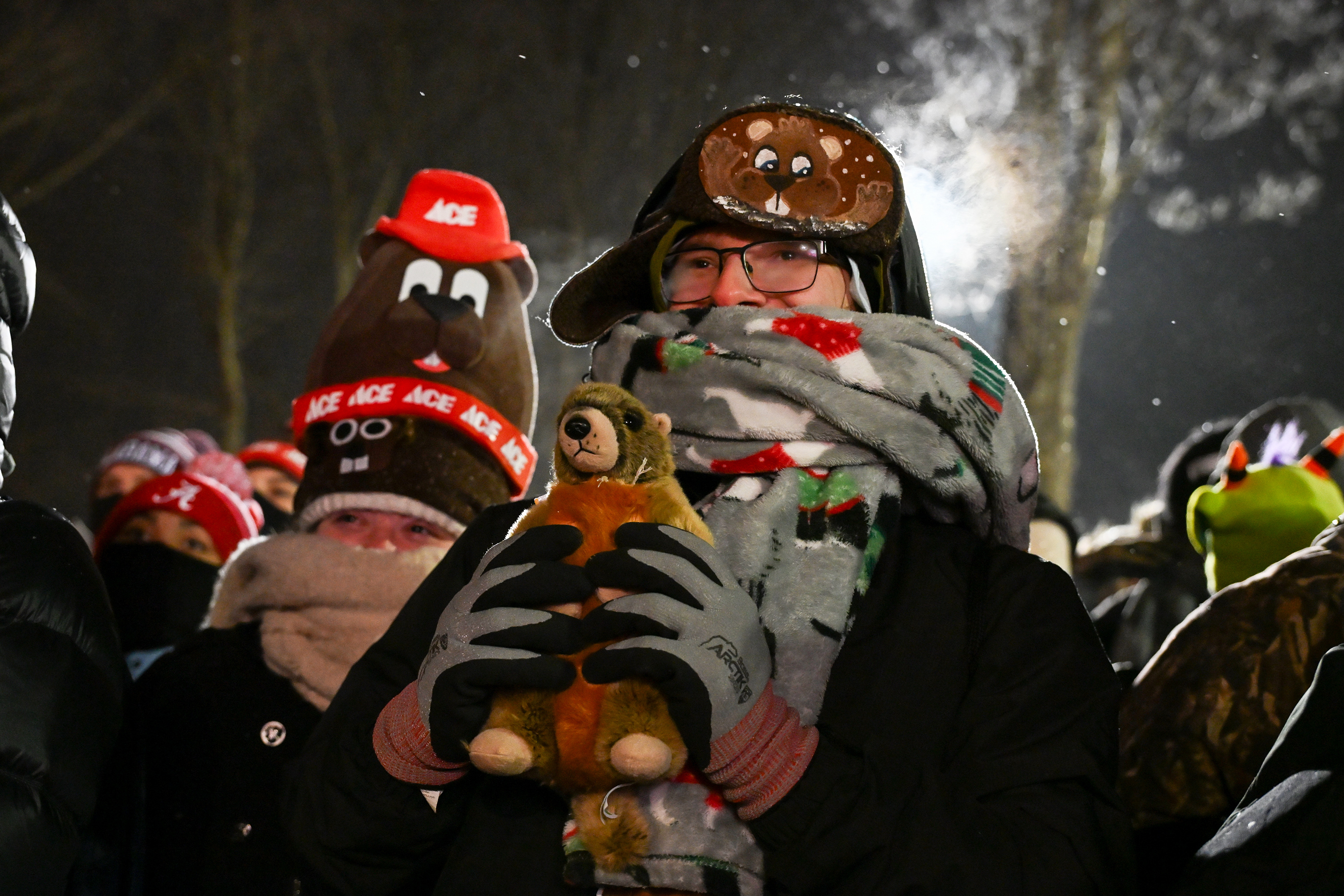 George Morar, of Youngstown, Ohio., celebrates while waiting for Punxsutawney...