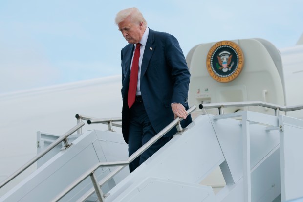 President Donald Trump walks off Air Force One at Lehigh Valley International Airport on Friday, Aug. 1, 2025, near Allentown. Trump was headed to his Bedminster, New Jersey, golf course for the weekend. (Anna Moneymaker/Getty Images)