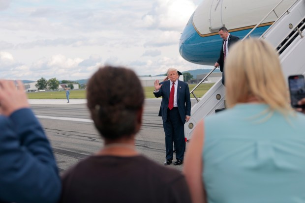 President Donald Trump walks off Air Force One at Lehigh Valley International Airport on Friday, Aug. 1, 2025, near Allentown. Trump was headed to his Bedminster, New Jersey, golf course for the weekend. (Anna Moneymaker/Getty Images)