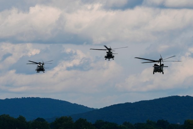 Marine One carrying President Donald Trump, left, takes off from Lehigh Valley International Airport, Friday, Aug. 1, 2025, near Allentown, en route to Bedminster, New Jersey (Julia Demaree Nikhinson/AP)