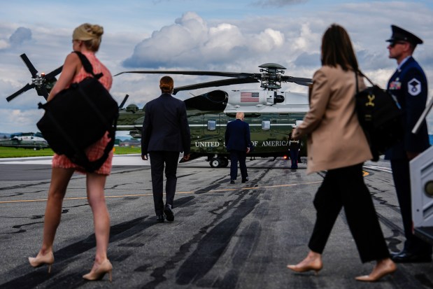 President Donald Trump, center, walks to Marine One after arriving on Air Force One at Lehigh Valley International Airport, Friday, Aug. 1, 2025, near Allentown, Pa. (Julia Demaree Nikhinson/AP)