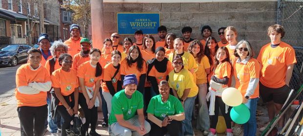 Gweny Love poses with volunteers from a neighborhood cleanup. (Contributed photo via Spotlight PA)
