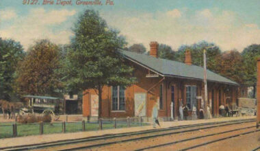 Color postcard of a brick railroad depot. Greenville, Pa., works to save depot.