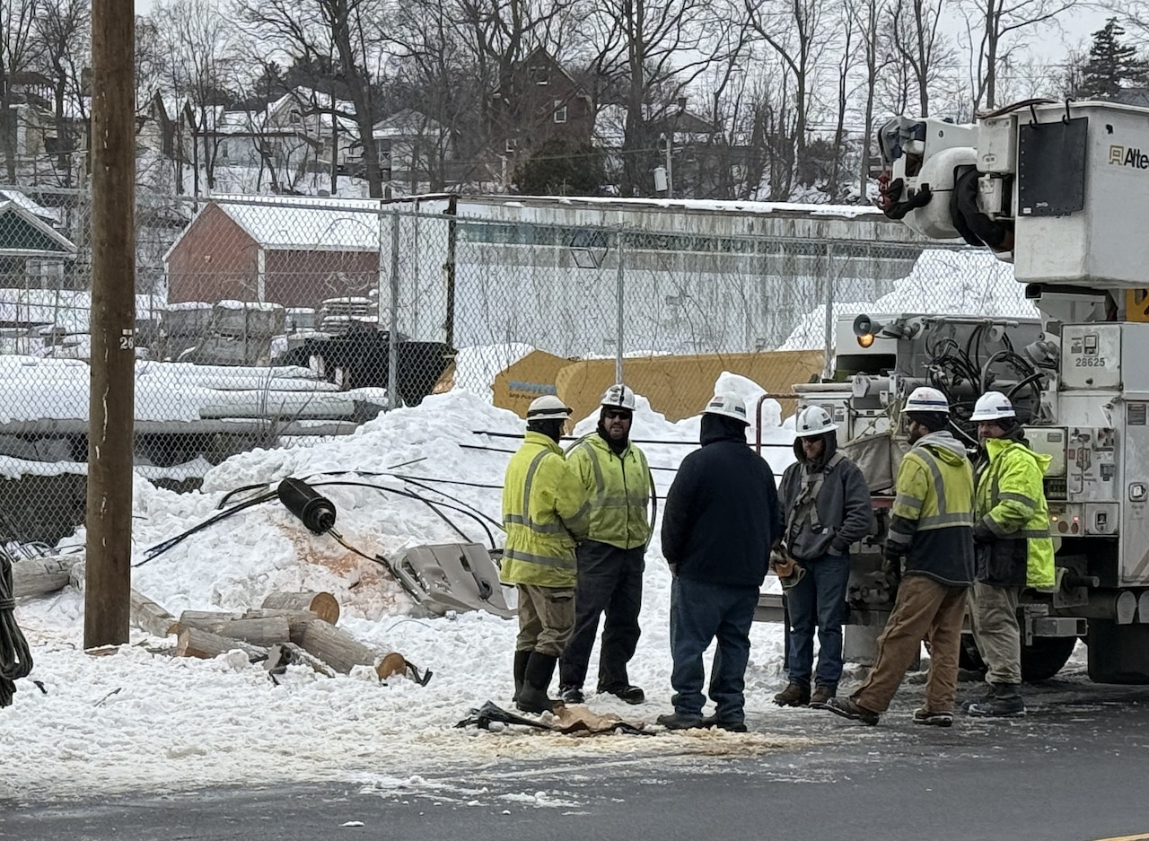 National Grid works to repair a power line and telephone pole near 1008 Erie Boulevard West where a car crashed and a man died following a vehicle pursuit involving the Onondaga County Sheriff's Office around 2:30 a.m. on Tuesday, February 3, 2026.