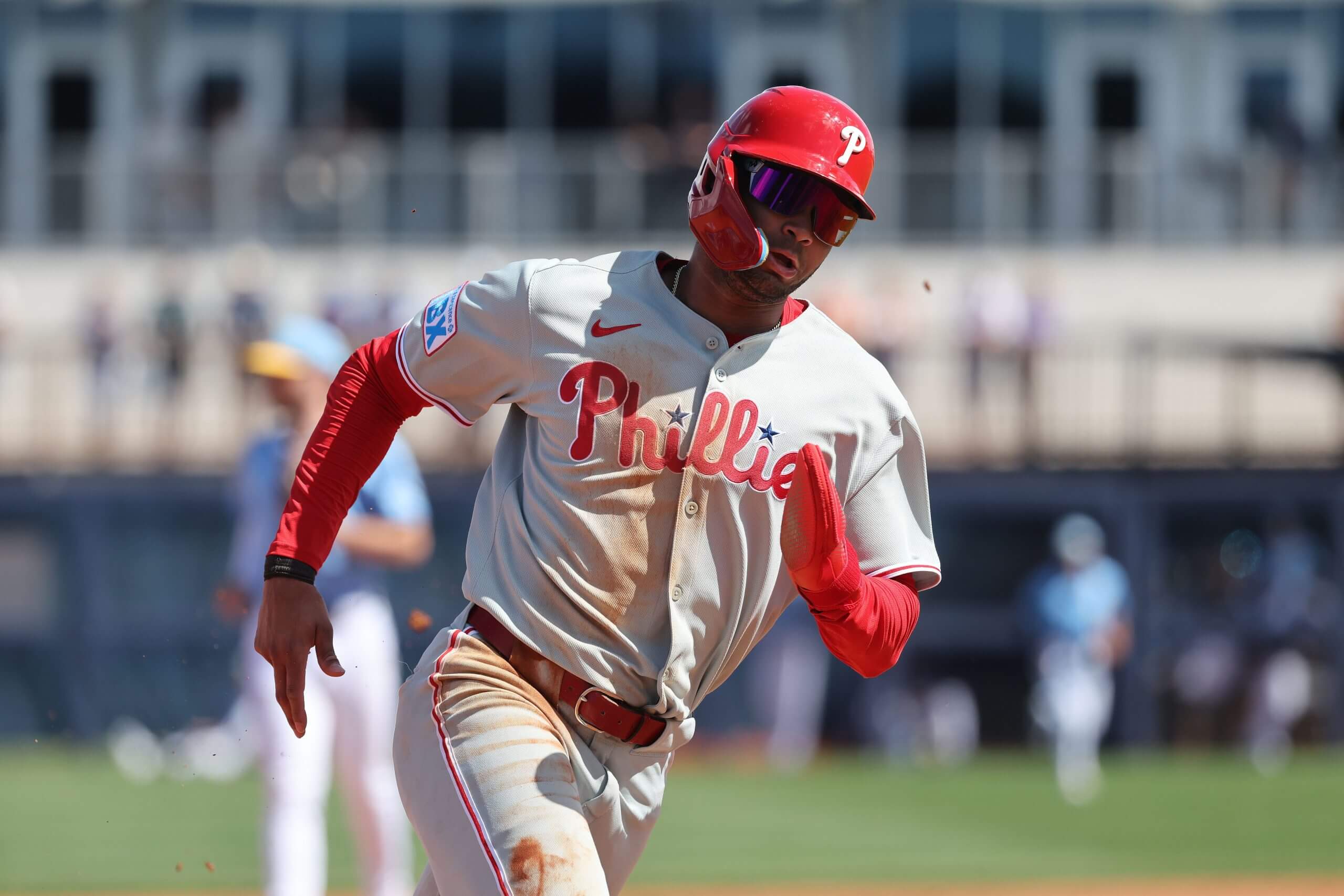 Philadelphia Phillies outfielder Justin Crawford (80) runs home to score against the Tampa Bay Rays during the fourth inning at Charlotte Sports Park.
