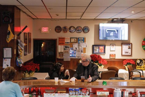 Clairton Mayor Jim Cerqua sits at the bar at the American Legion in Clairton, Pa. with newly elected city council member Marla Bradford, his running mate, on Monday, Jan. 5, 2026. (Quinn Glabicki/Pittsburgh's Public Source via AP)
