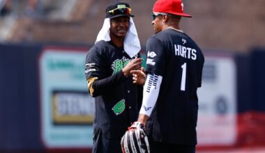 Eagles wide receiver DeVonta Smith (left) shown with quarterback Jalen Hurts during the Smith's celebrity softball game in 2023.